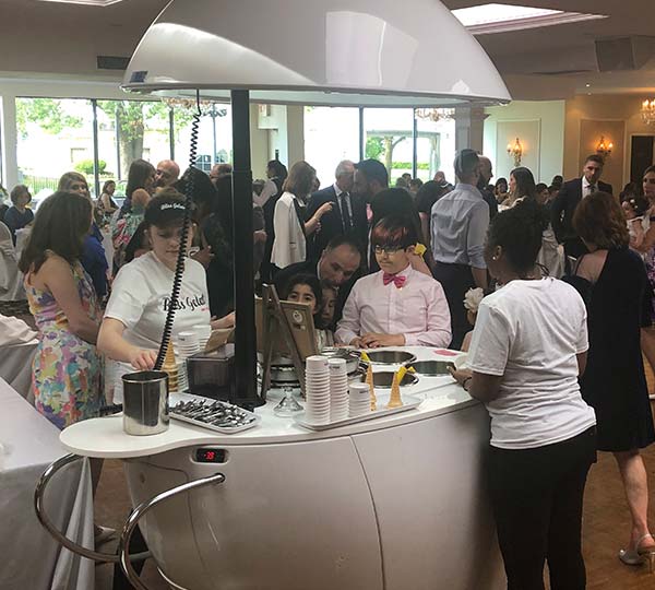 Woman Serving Gelato from Cloud Gelato Cart